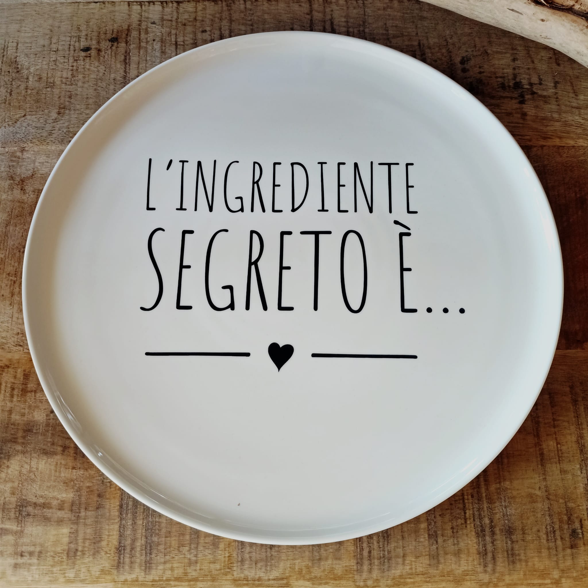 Piatto pizza “l’ingrediente segreto è”